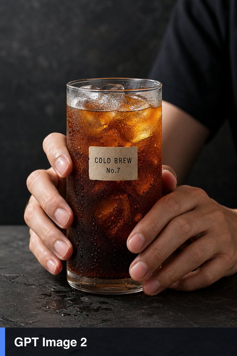 超写实工作室产品静物:两只人手握着一只高高的透明玻璃杯,杯中盛有加冰的琥珀色冷萃咖啡,玻璃杯外布满凝结的水珠,冰块折射效果逼真,五指解剖结构正…, 图片 1