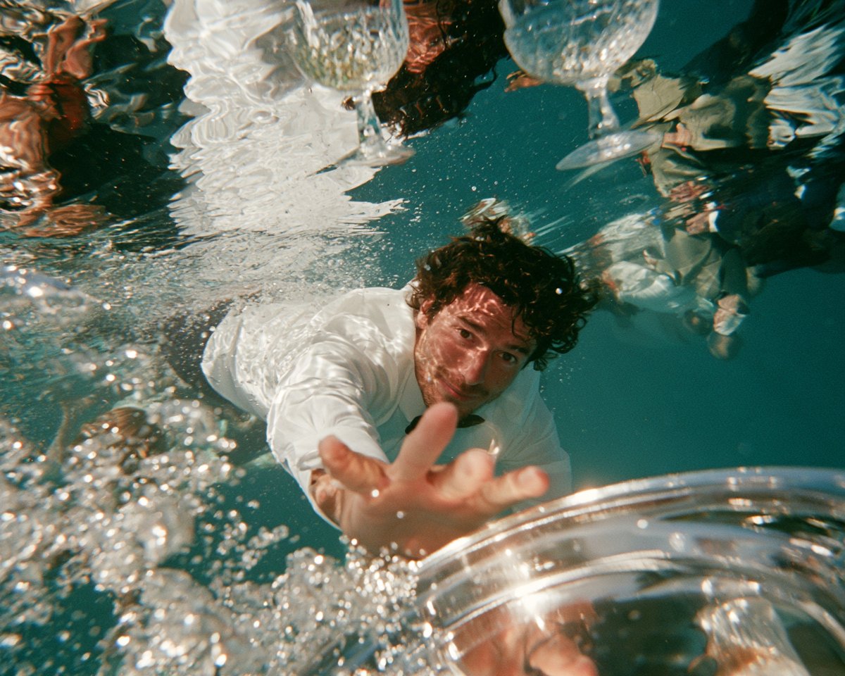 underwater disposable-camera photograph inside a flooded rooftop infinity pool,…