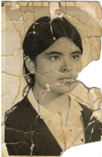 Cinematic portrait restoration. Strictly preserve original pose, expression, an…