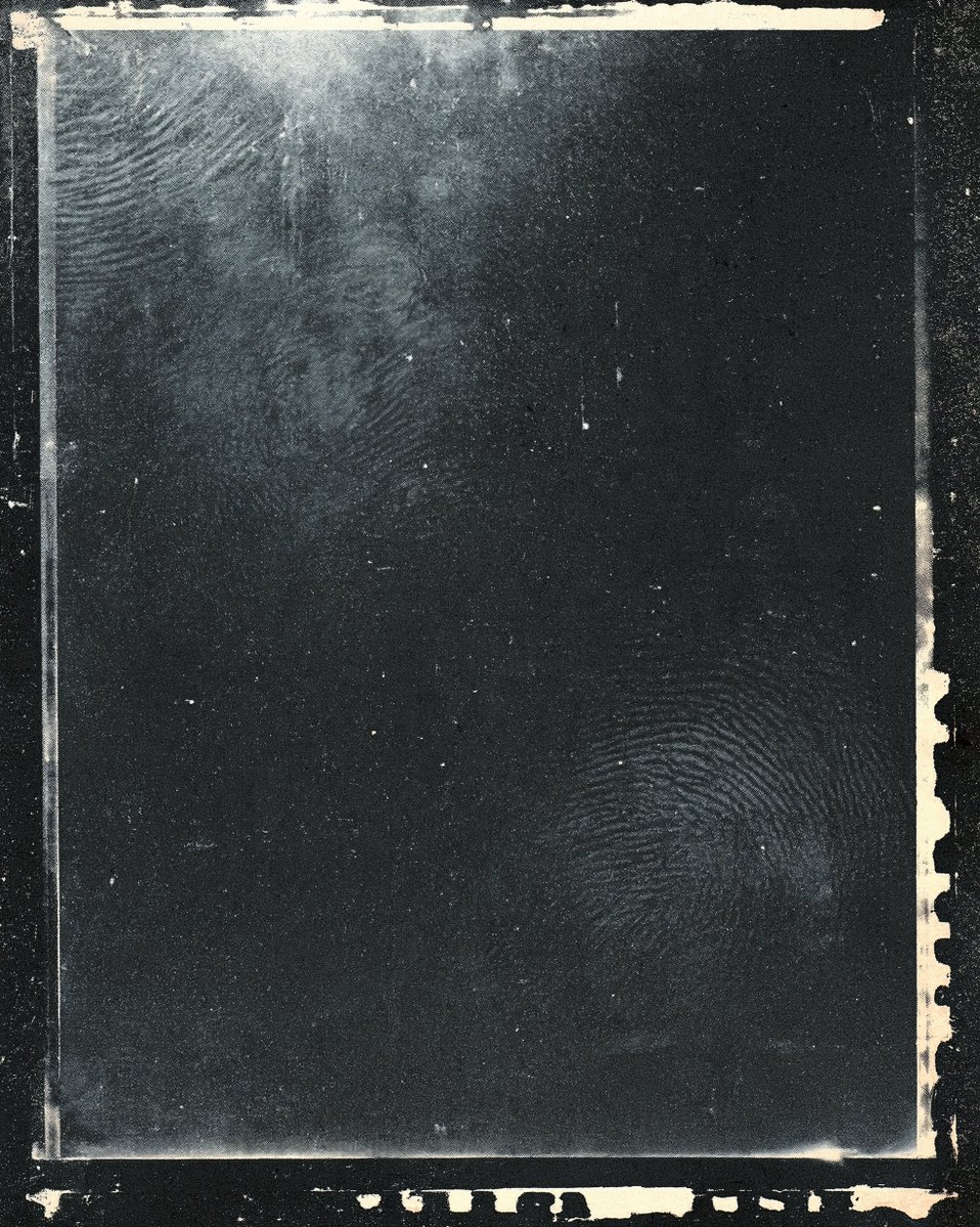 A dark, abstract, and textured image with a vintage, distressed aesthetic. The …