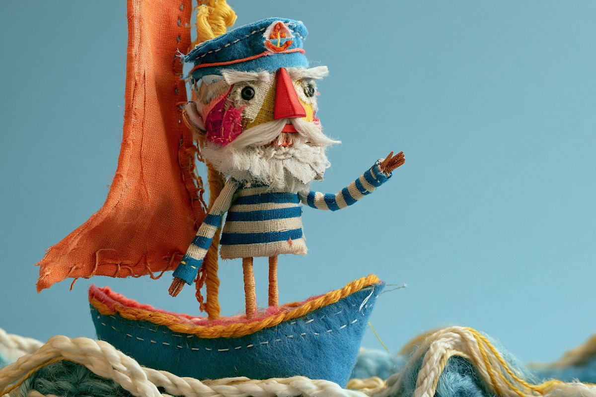 A stop-motion scene featuring a whimsical sculpture of a [subject], handcrafted…