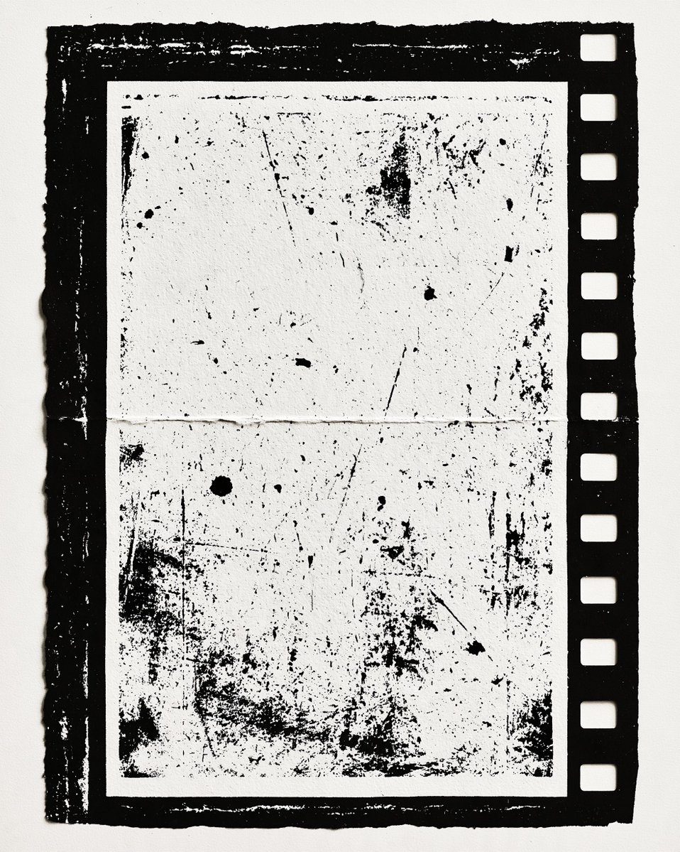 A black and white vintage film frame with a textured, grainy surface. The frame…